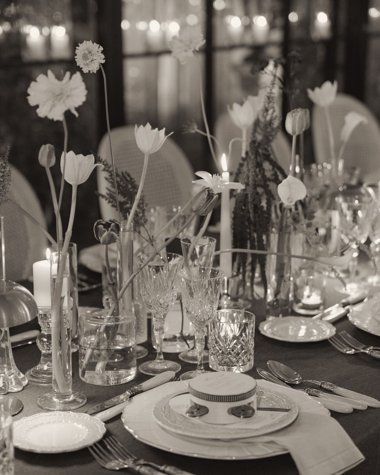 Candlelit table with florals and crystal glasses