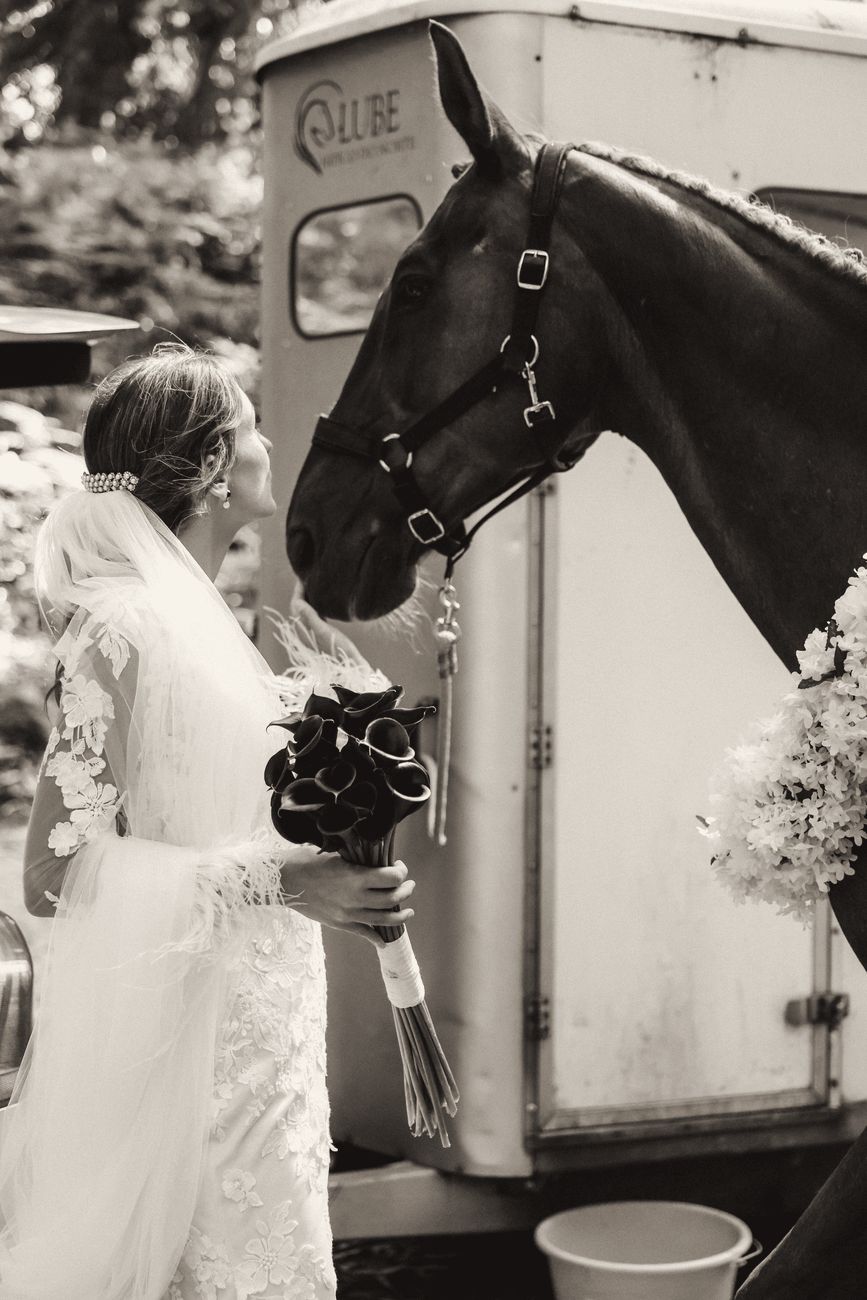 Bride with a horse dressed in flowers