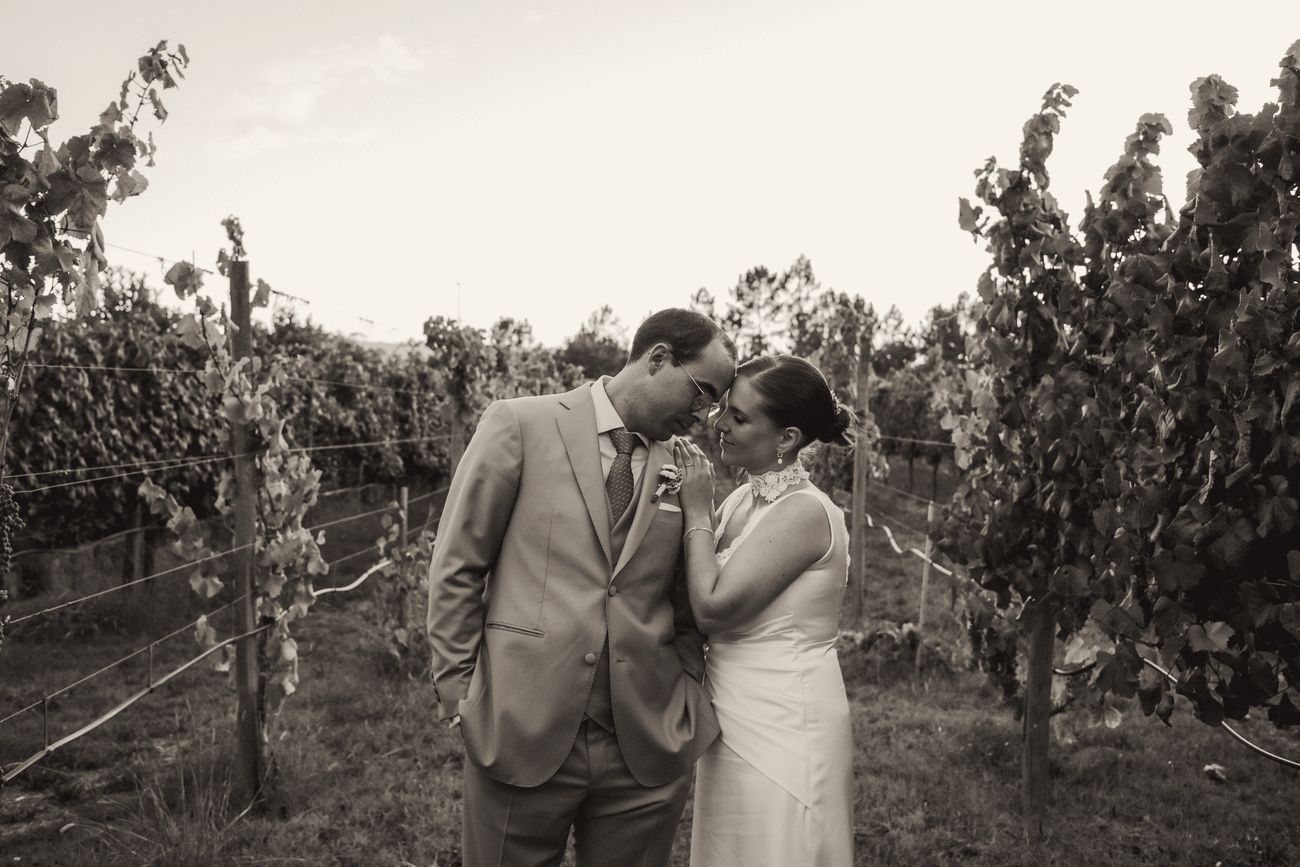 Couple kissing among the vines