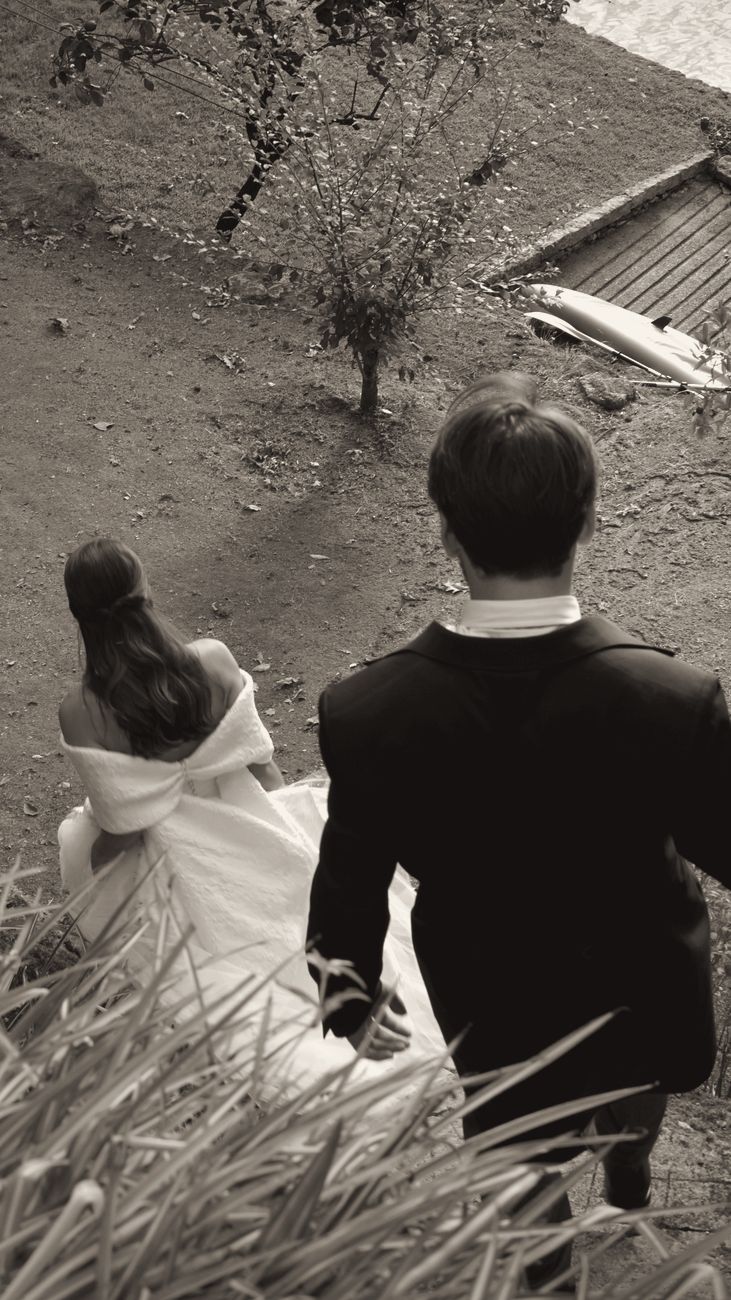 Couple running down a hill