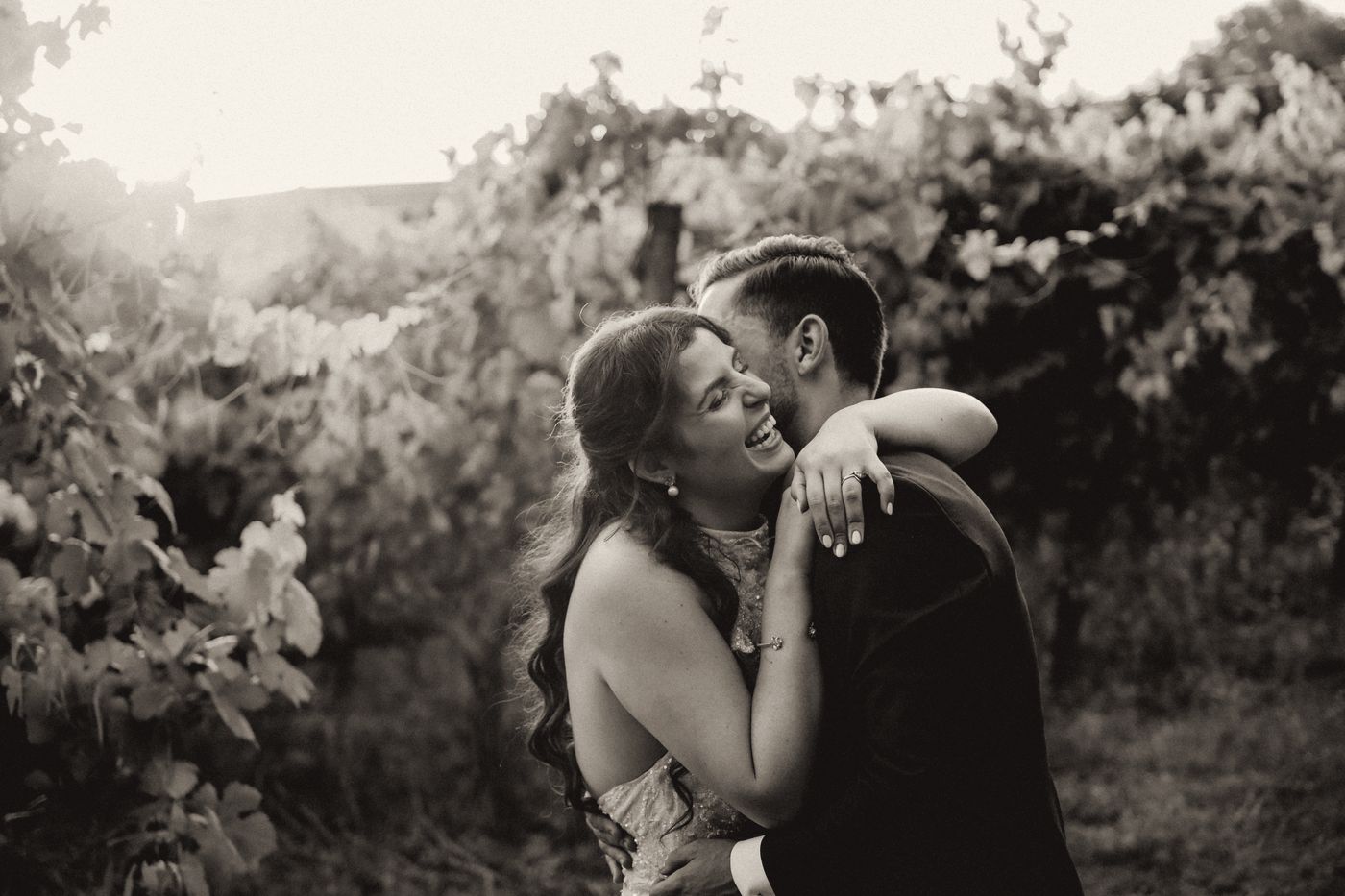 Couple embracing among the vines